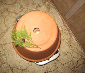 flower pot heater with cedar--bringing the sweat lodge home.